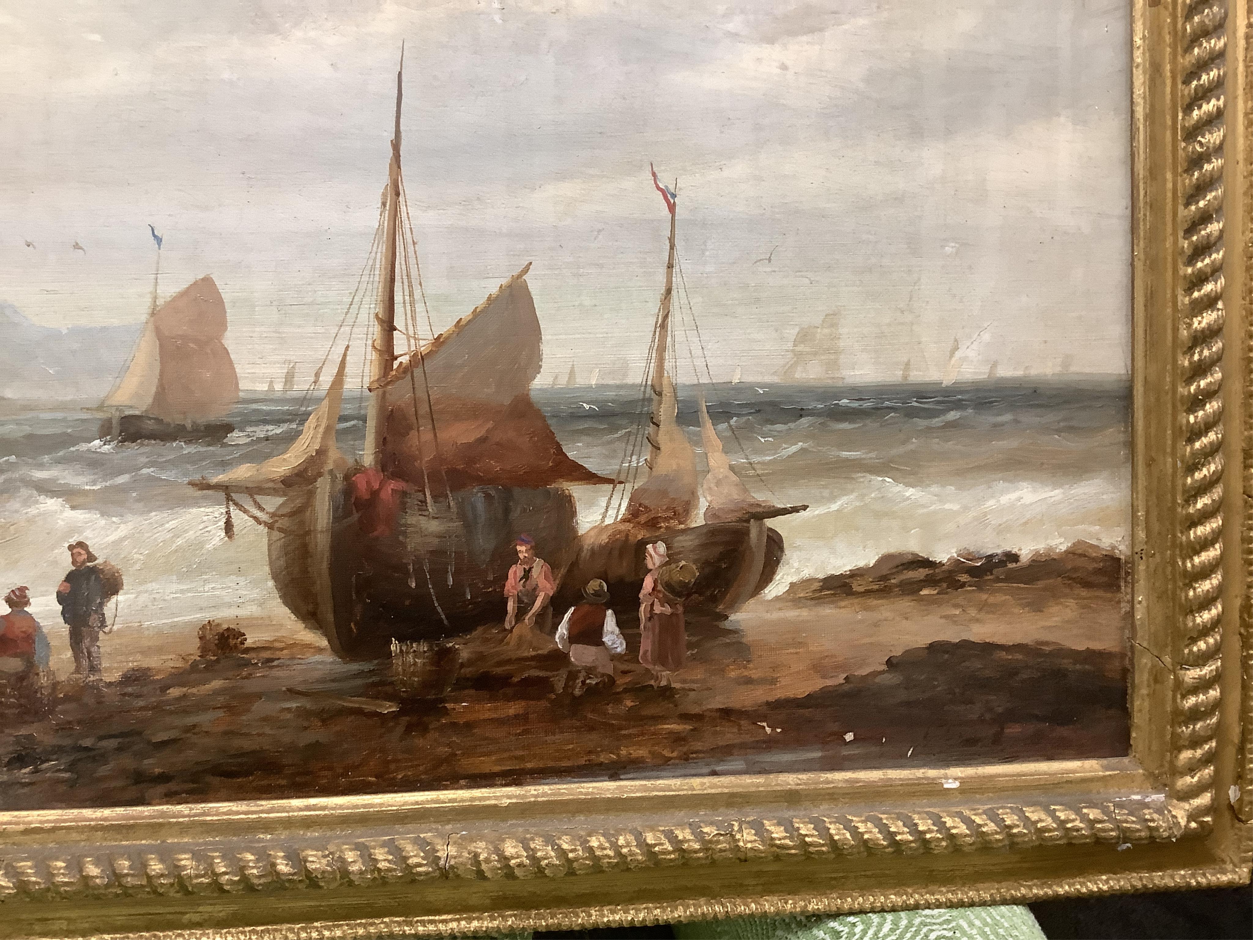 British School, 19th century, oil on canvas, Beach scene with figures, fishing boats, village and hills beyond, 37 x 67cm. Condition - fair, some losses to the paint